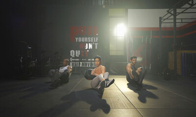 Group of multi ethnic people doing kettle bell twist, cardio. Strength training workout at gym fitness center club. Exercise indoor with sport equipment. People lifestyle recreation. Strong team.