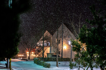 house at night in snow