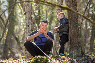 a boy and his dad found something in the forest, mushroom pickers or treasure hunters