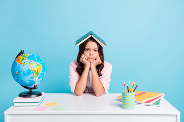 Photo of young pretty unhappy upset stressed girl hold book one head tired studying isolated on...