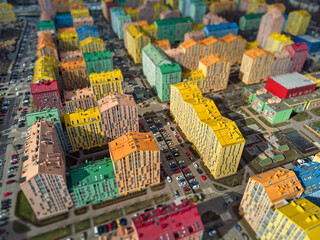 Aerial top view of a drone in the colorful modern city. Comfort town Kyiv Ukraine. Tilt shift...