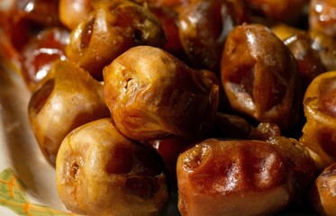 Close up of sweet sukkari dates fruit from Saudi Arabia for ramadan