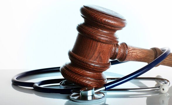 Gavel and Stethoscope on white Background with Selective Focus.