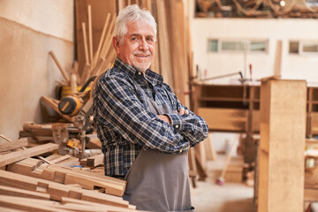 Senior as a master carpenter in his workshop