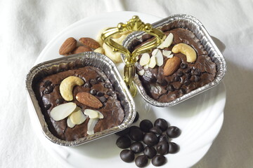 Fresh homemade fudge chocolate brownies on white plate with Chocolate and grain.  