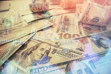 Multi exposure of forex chart drawing over us dollars bill background. Concept of financial success markets.