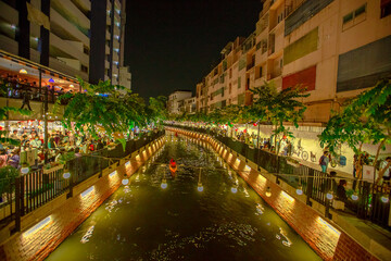 Canal Ong Ang(Klong Rop Krung)- Bangkok:27March2021,Atmosphere around the walking street along Khlong Thom Khlong Pathum ,tourists come to see products and services at night, Samphanthawong Thailand