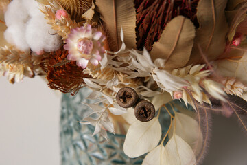 Beautiful dried flower bouquet in glass vase, closeup