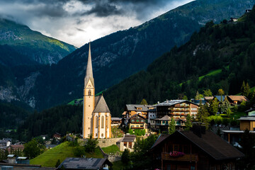Village Of Heiligenblut In Front Of Mountain Großglockner In The Clouds In Austria