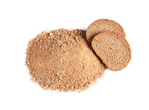 Fresh Bread Crumbs And Slices Of Loaf On White Background, Above View