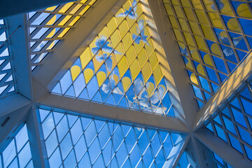 A glass dome with a picture of doves soaring in the sky in the pyramid building of the Palace of Peace and Reconciliation in the city of Astana.