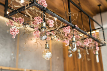 Decor with floral arrangement and Edison lamps