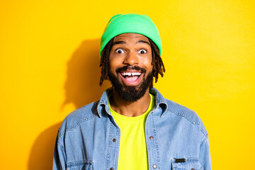 Photo of young handsome happy cheerful excited crazy african man see big sale discount isolated on yellow color background