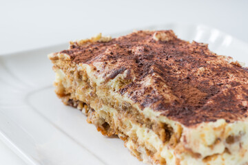 Italian dessert, close up of a slice of homemade tiramisu