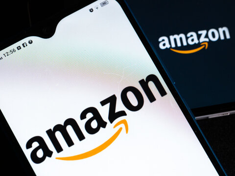 In this photo illustration Amazon.com, Inc. logo seen displayed on a smartphones