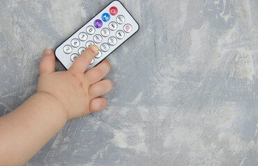 baby hand with remote control