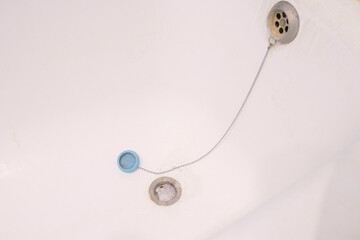clogged bathroom sink with hair and dirt