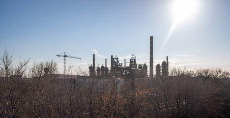 Fototapeta na wymiar factory chimneys on a blue sky background