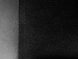 Black paper background. Contrast and minimalism concept.