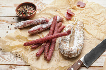 Tasty sausages on wooden background