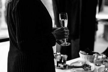 A woman holding a champagne glass in close-up