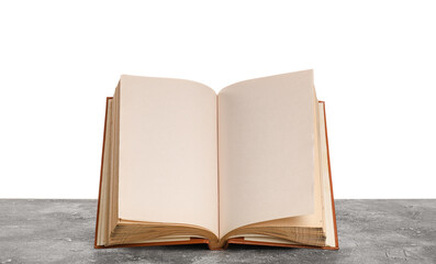 Open old book on table against white background