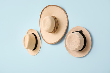 Stylish hats on color background