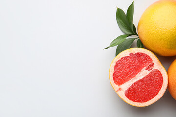 Fresh grapefruits on light background