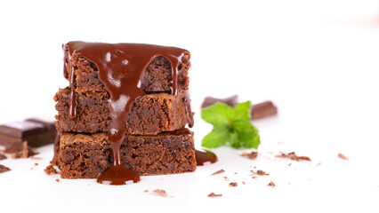 chocolate brownie cake and chocolate sauce pouring