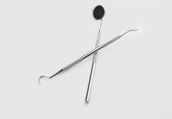 Dentist's tools on white background