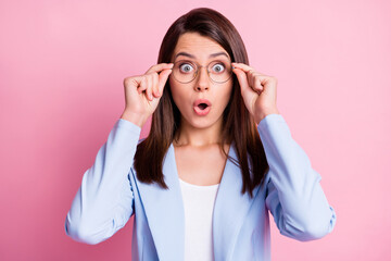 Photo of young beautiful girl amazed shocked surprised news rumor novelty hand touch glasses isolated over pink color background