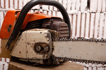 Chainsaw with traces of operation close-up of elements
