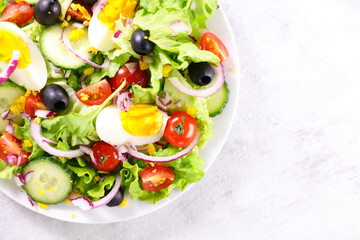 vegetable salad with egg,  cucumber and tomato