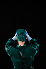 A young female surgeon was wearing a surgical cap 