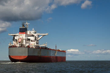 MARITIME TRANSPORT - A merchant vessel sails to the sea 