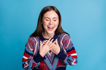 Photo of young cheerful girl happy positive smile hands on chest humor joke laugh isolated over blue color background