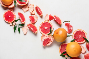 Composition with ripe grapefruits on white background