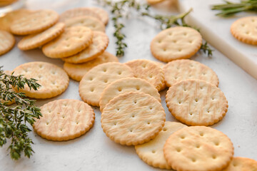 Tasty crackers on light background