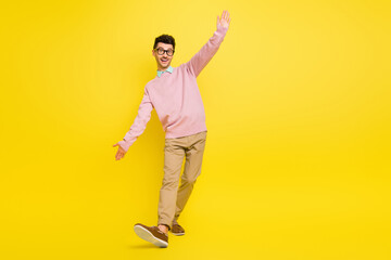 Fototapeta na wymiar Full body photo of young excited man happy positive smile have fun dance isolated over yellow color background