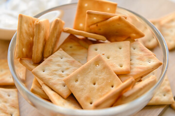 Bowl of tasty crackers, closeup