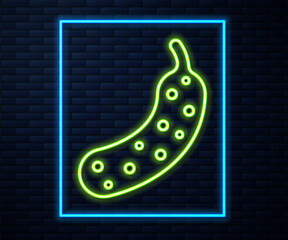 Glowing neon line Fresh cucumber icon isolated on brick wall background. Vector