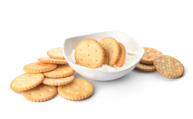 Bowl of tasty crackers on white background