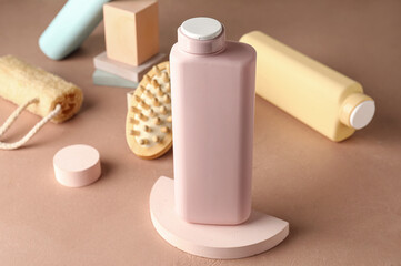 Bottles of shower gel and bath supplies on color background