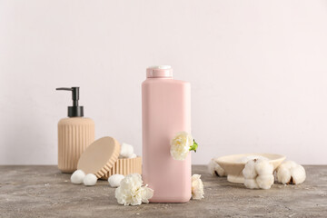 Composition with shower gels on light background