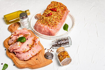 Pork fillet for grilling, baking, or frying with flakes spices