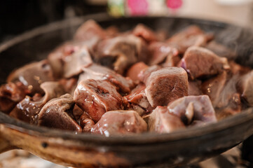 Fried veal liver in a pan. Braised cow and pork liver