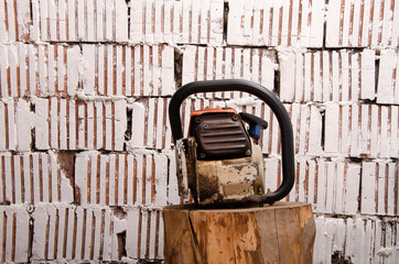 Chainsaw with traces of operation, front view