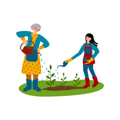 Grandmother and granddaughter are working in the garden, watering young plants. help for the elderly. The joy of working outdoors. Family gardening.