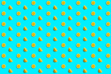 Repeating patterns composed of lemon slices and lemon halves on a light blue background