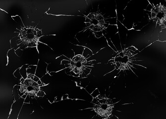 Hole in the glass on a black background